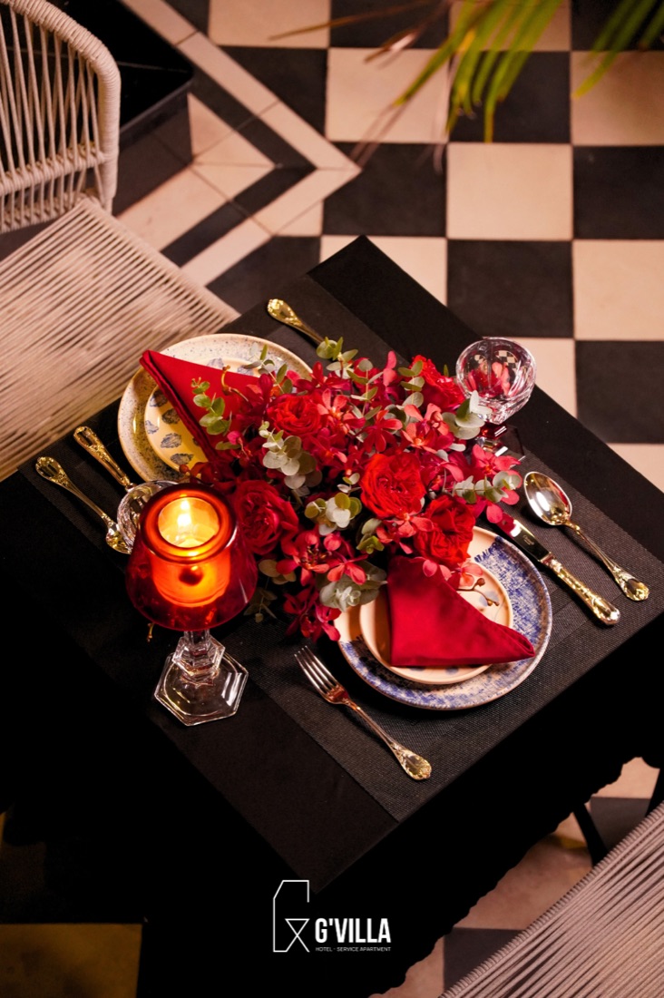 Private dining table setting with roses at G'Villa